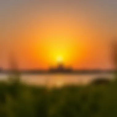 A vibrant sunset casting a golden glow over Lake Khalid