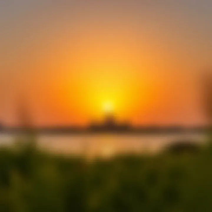A vibrant sunset casting a golden glow over Lake Khalid